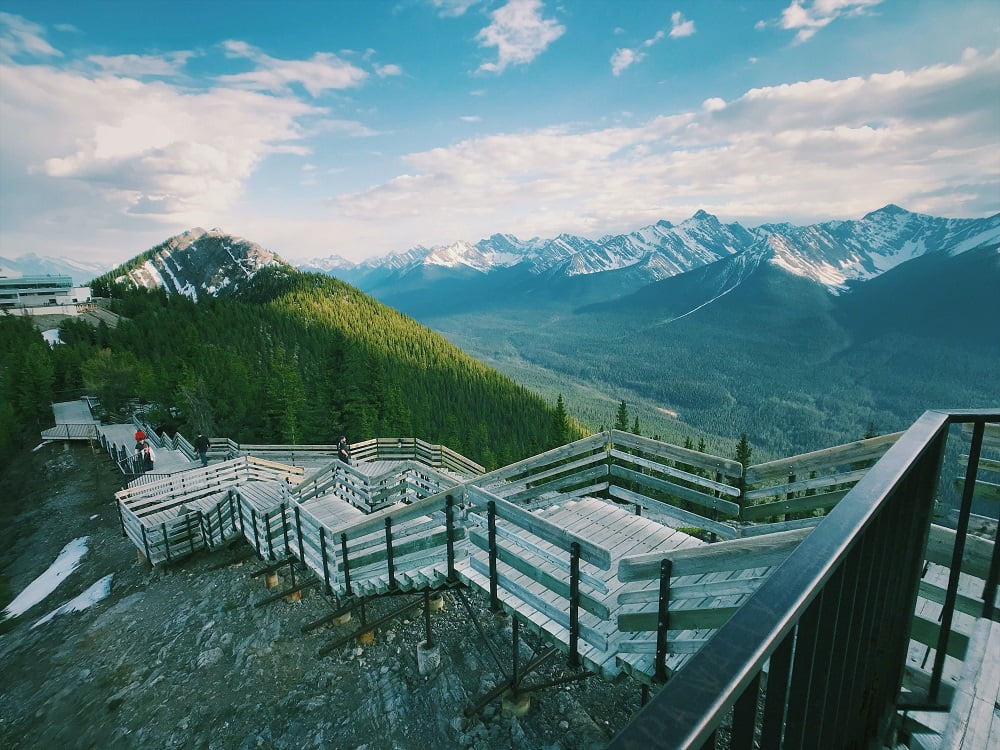 A scenic view of the mountains from the top of a grand staircase.